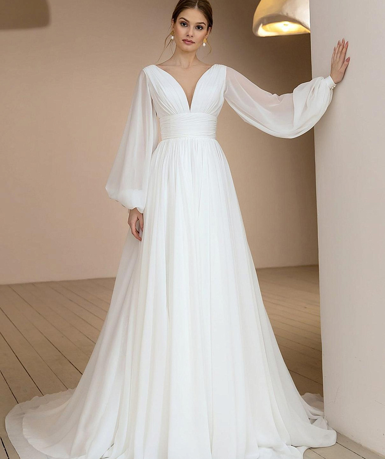 Воздушное свадебное платье с объемными рукавами