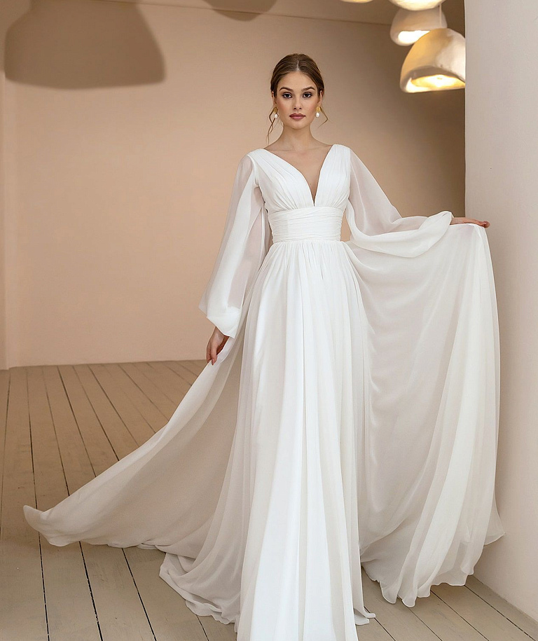 Воздушное свадебное платье с объемными рукавами